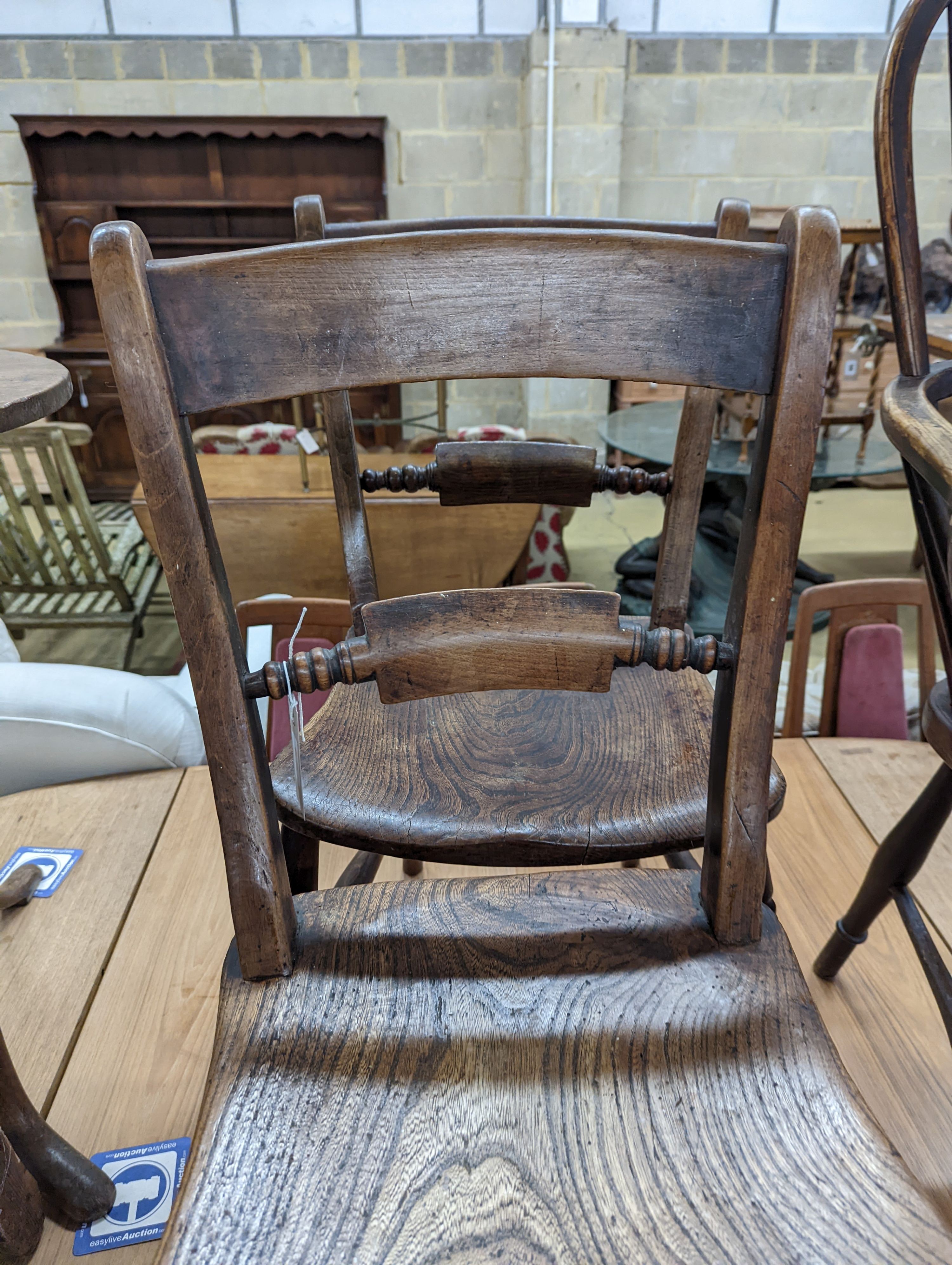 A pair of Victorian Windsor elm and beech kitchen chairs. H-83cm.